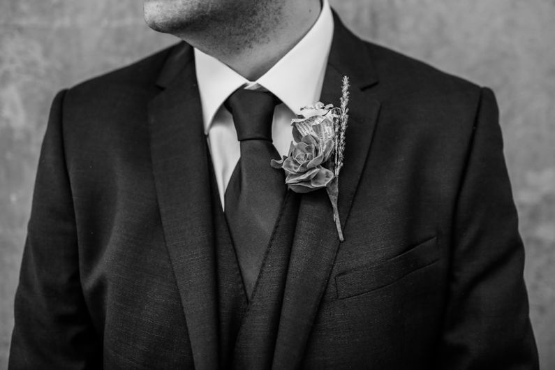 Buttonholes - grayscale photo of man looking right