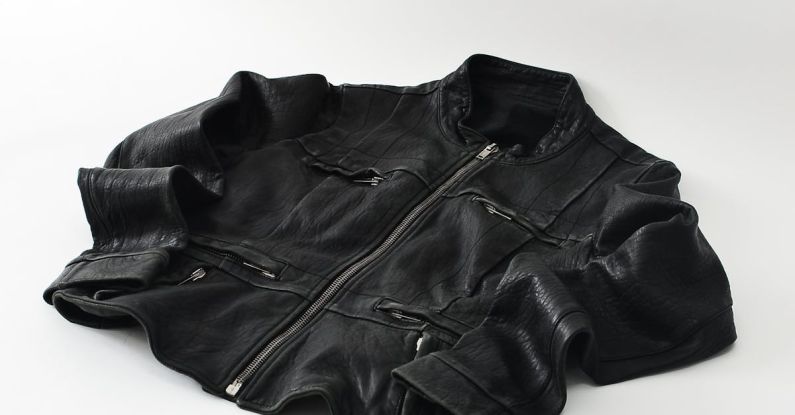Lapped Zipper - Modern black leather jacket on white background
