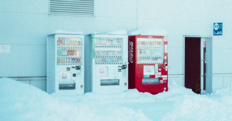 Quilting Machine - A vending machine and a snow covered building