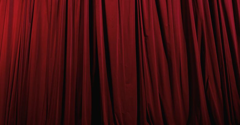 Fabric - A Red Pleated Curtain on a Theater Stage