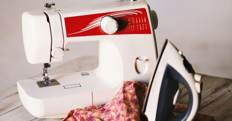 Sewing Machine - White Sewing Machine, Clothes Iron, and Scissors