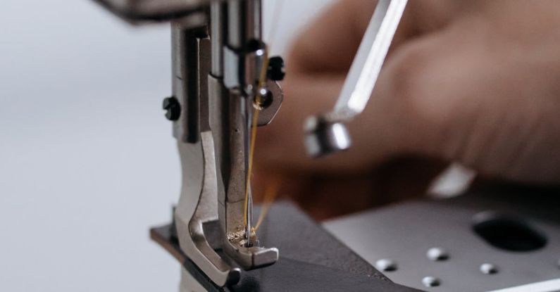 Hand Sewing - A Person Sewing a Black Leather Fabric