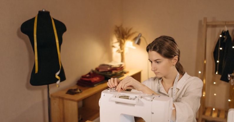 Overlock - Woman Sitting in Front of Sewing Machine