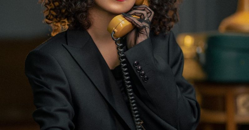 Corded Buttonhole - Woman with Curly Hair Talking on Corded Phone